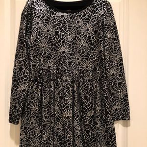 Girls spider web patterned dress with long sleeves.
